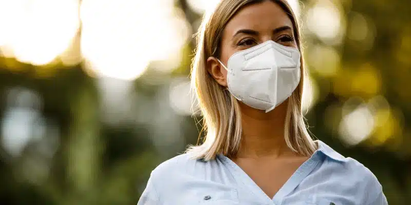 Woman wearing N95 mask outdoors